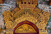 Luang Prabang, Laos - Wat Pa Phai the 'Bamboo Forest Monastery', detail of the main doorway gilded and covered with mosaics. 